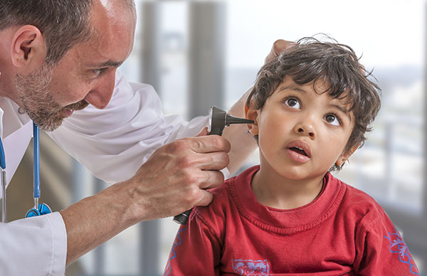 Riverside urgent care physician treating a child